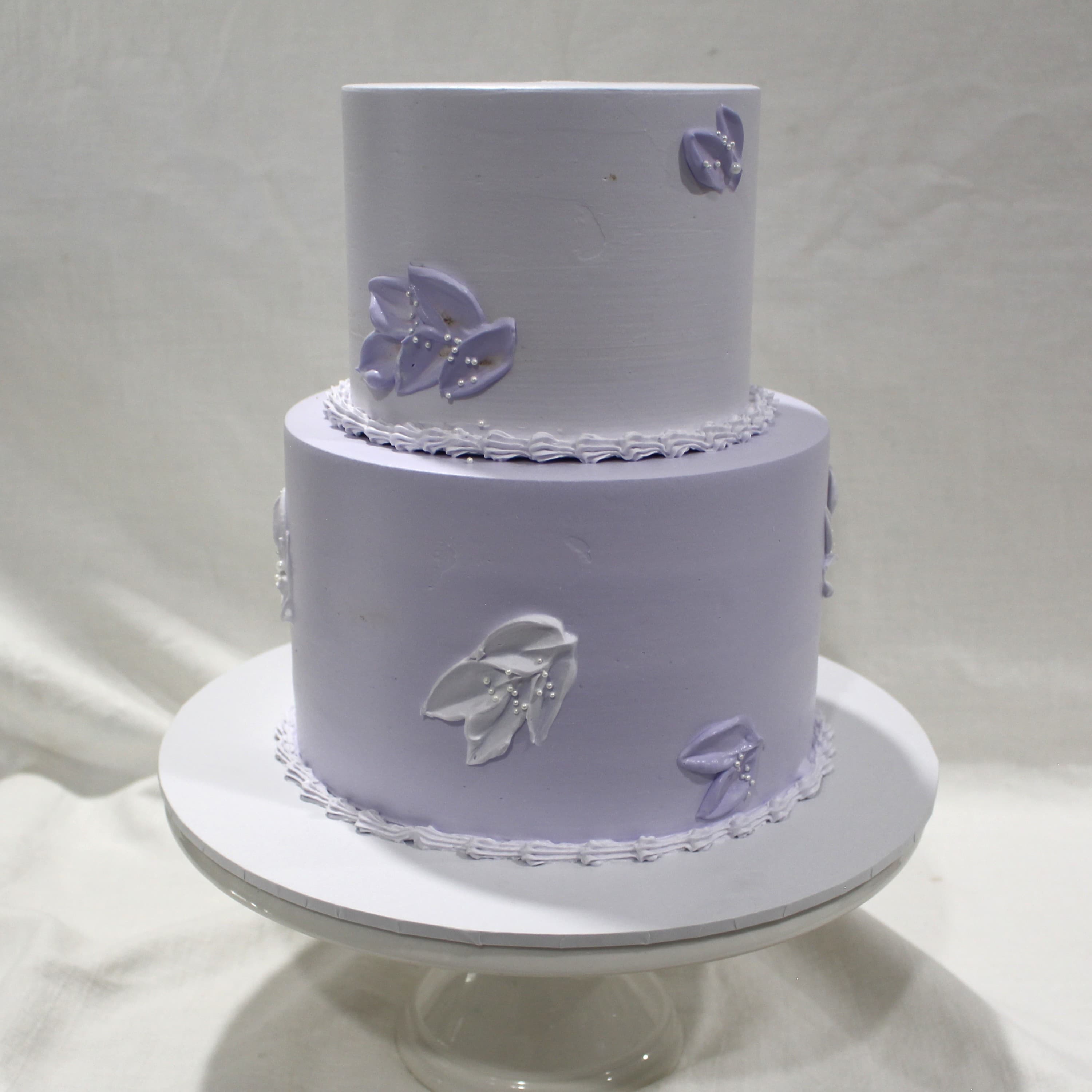 Custom cake with lavender leaf tier detail — Angel Bakes, Adelaide