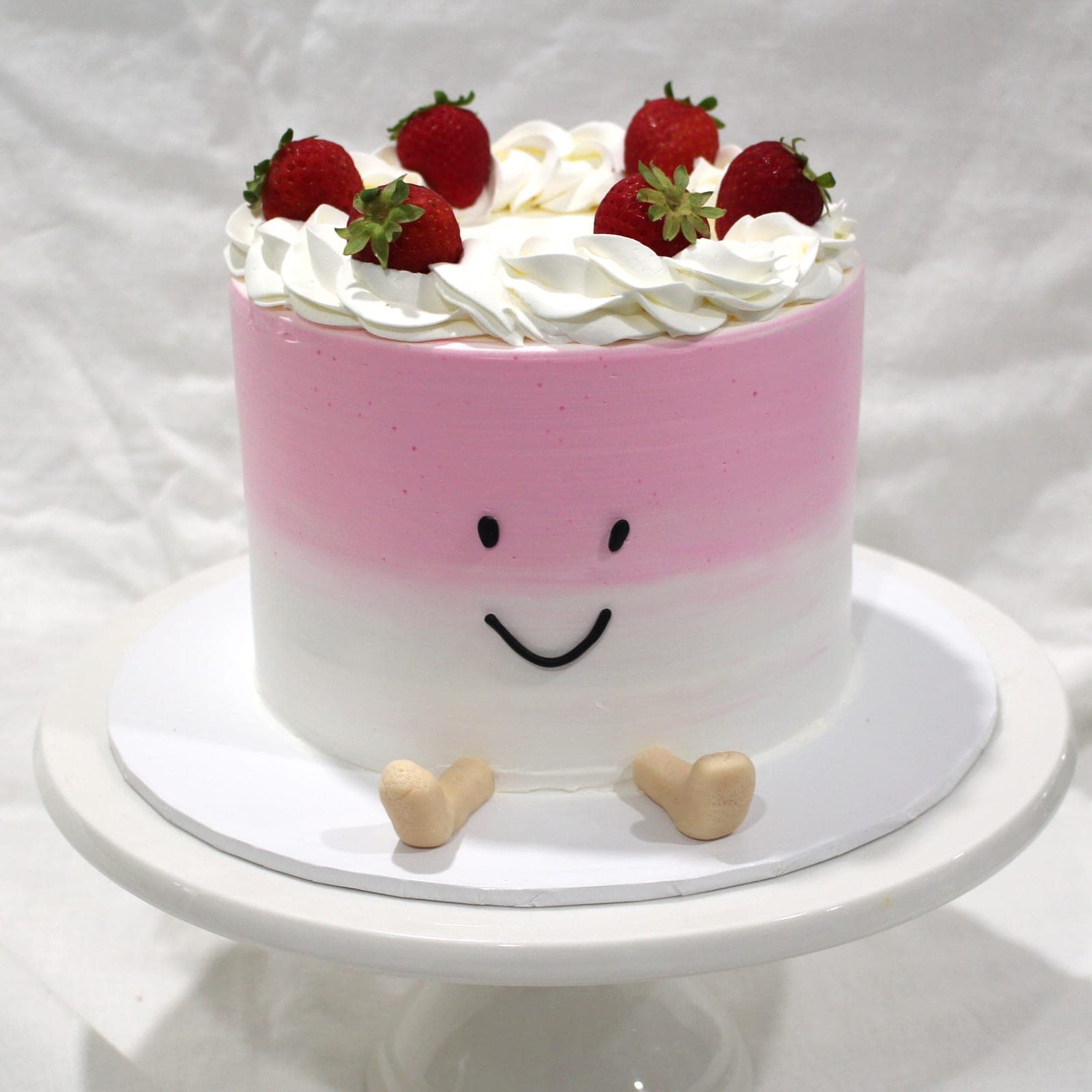 Custom cake with pink smiley strawberry tier detail — Angel Bakes, Adelaide