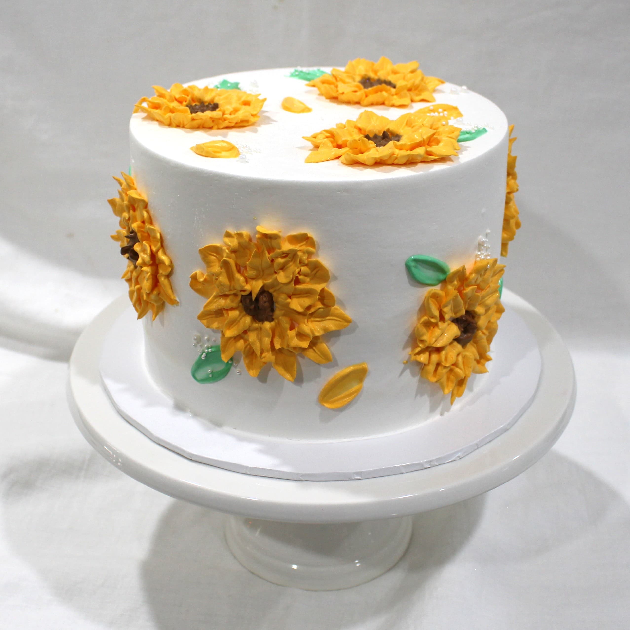 Custom cake with sunflower tier detail — Angel Bakes, Adelaide