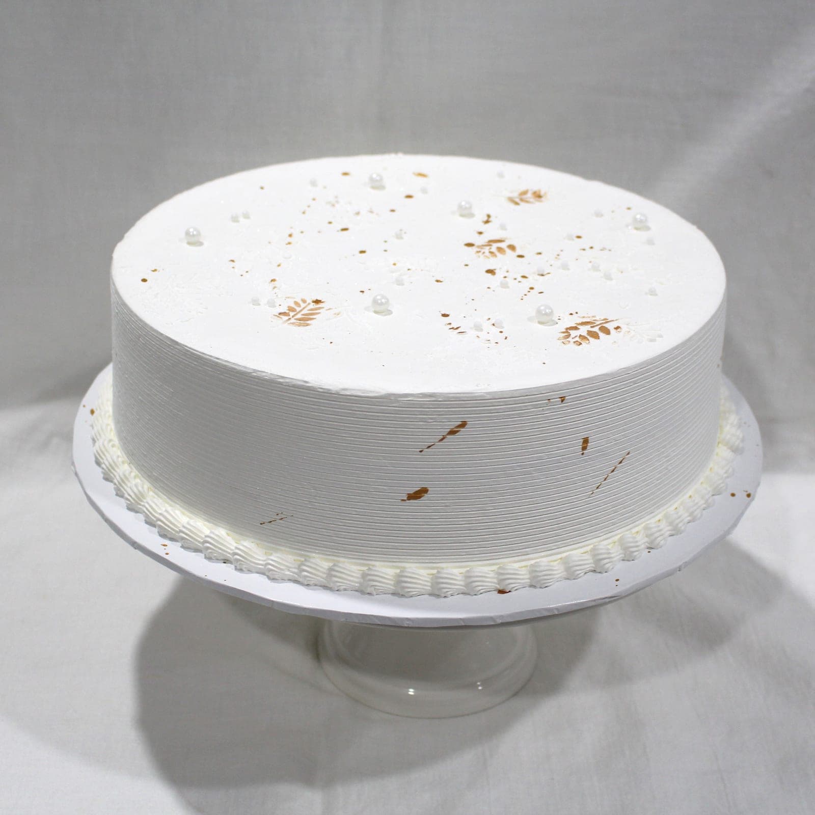 Custom cake with white pearl leaf splatter detail — Angel Bakes, Adelaide